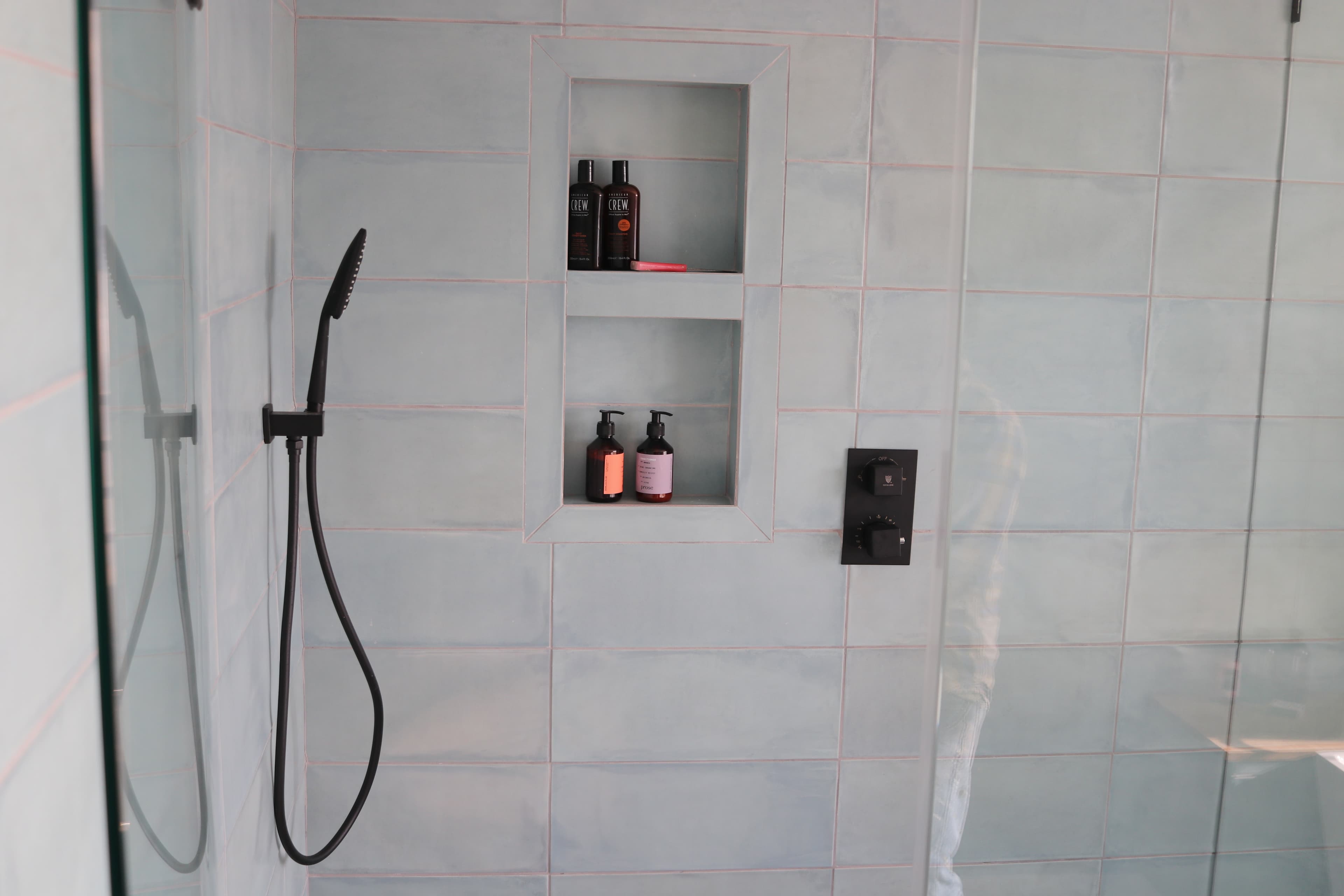 Accessible walk-in shower with grab bars and bench seating in a St. Petersburg bathroom remodel
