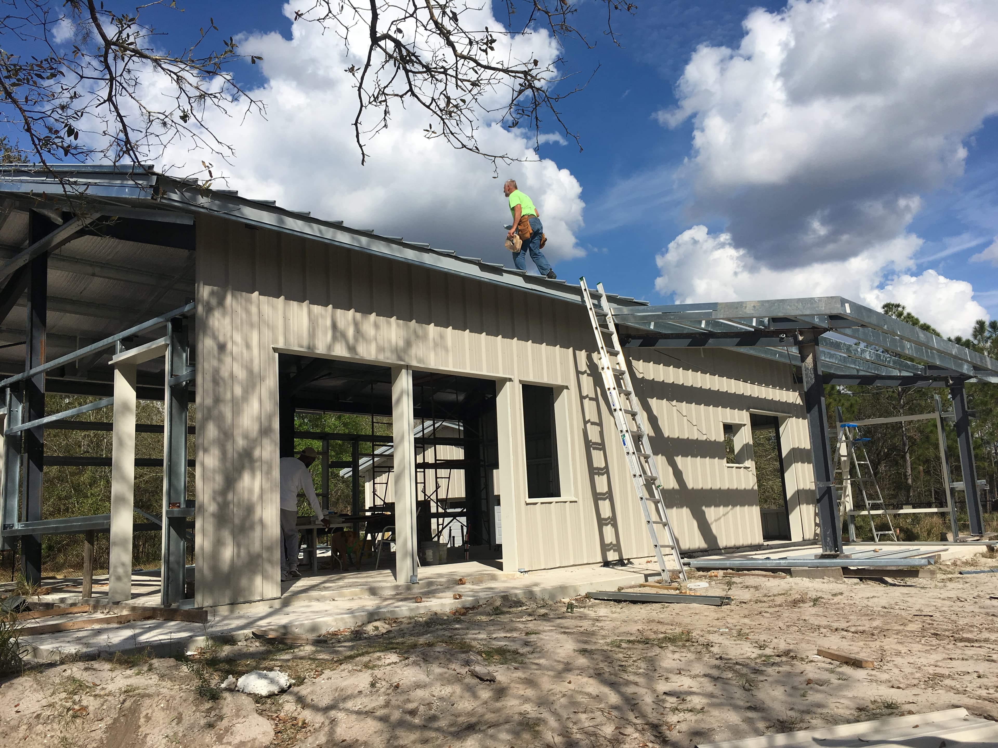 Steel building construction in progress for a commercial project in Pinellas County