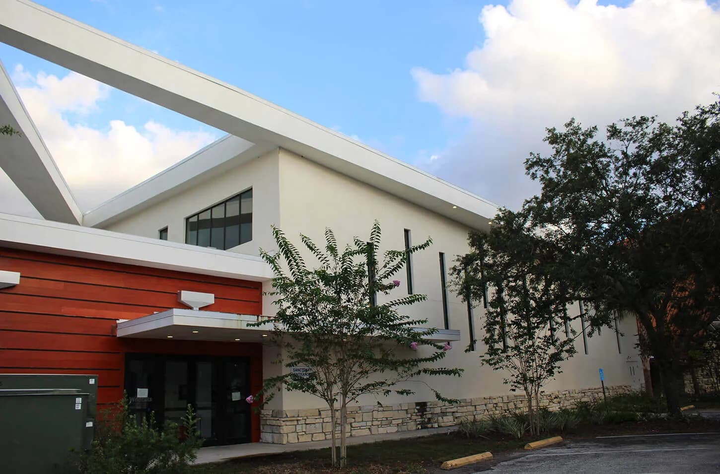 Completed commercial building exterior with modern architectural beams