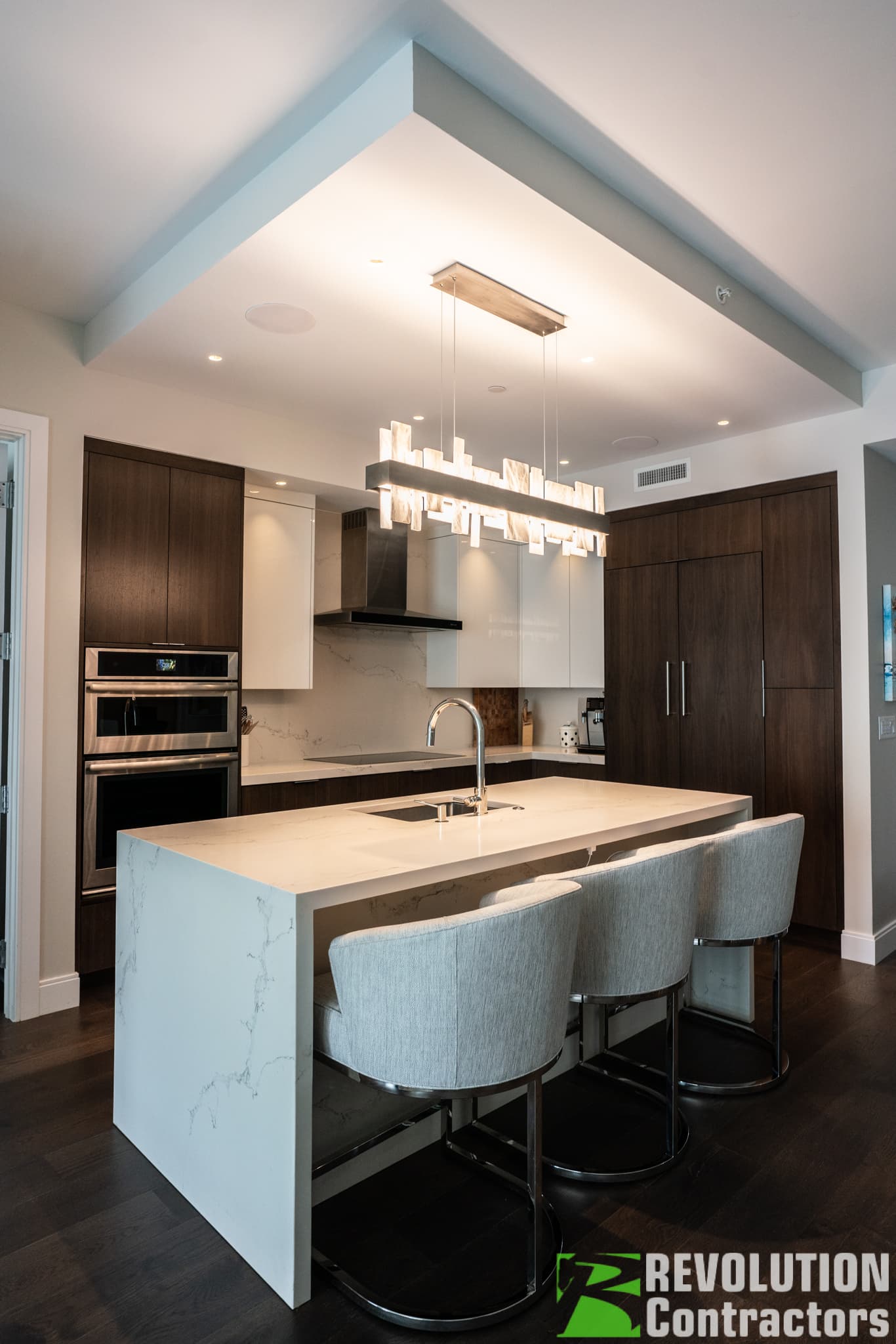 Open-concept condo kitchen remodel with island and modern finishes