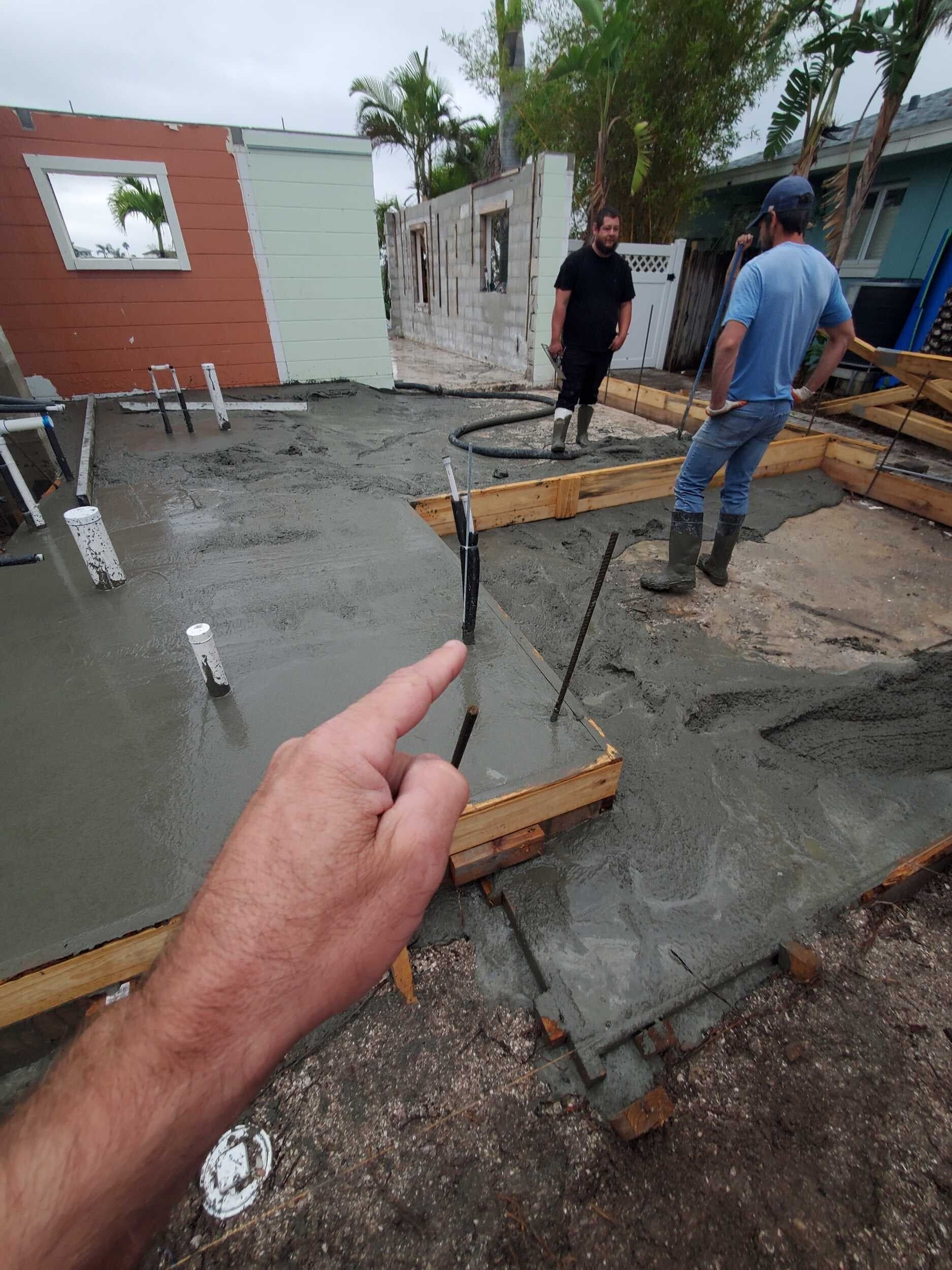 Concrete slab being poured for a new custom home foundation in St. Petersburg