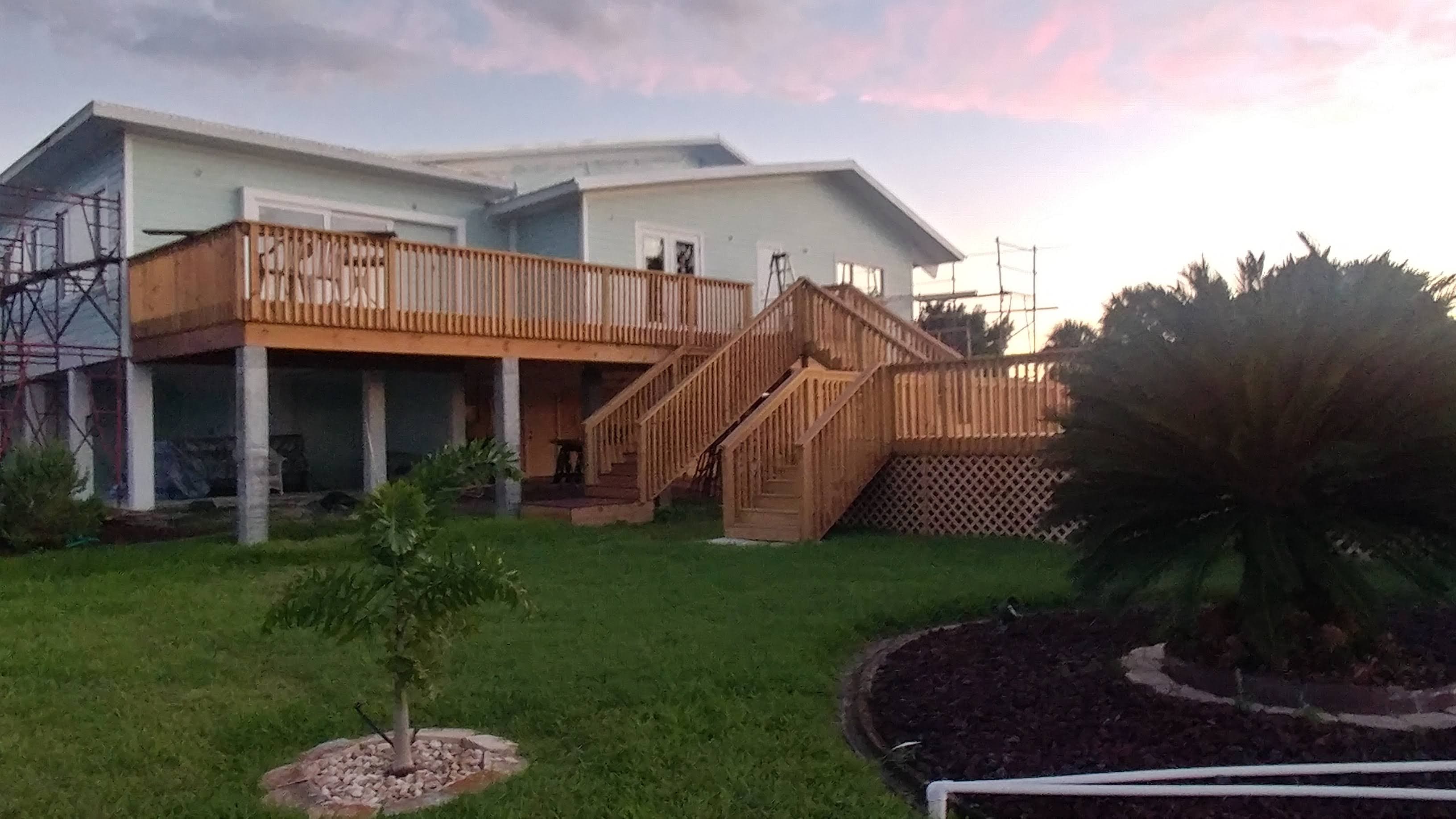 Completed elevated custom home exterior in St. Petersburg at sunset