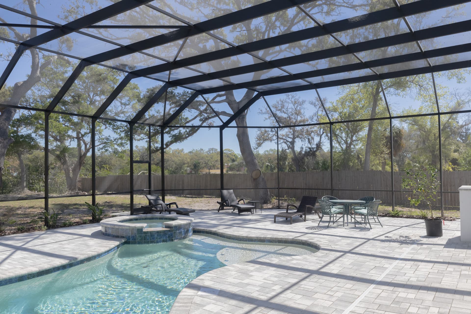 Completed elevated home with pool and patio area on Harbor Drive