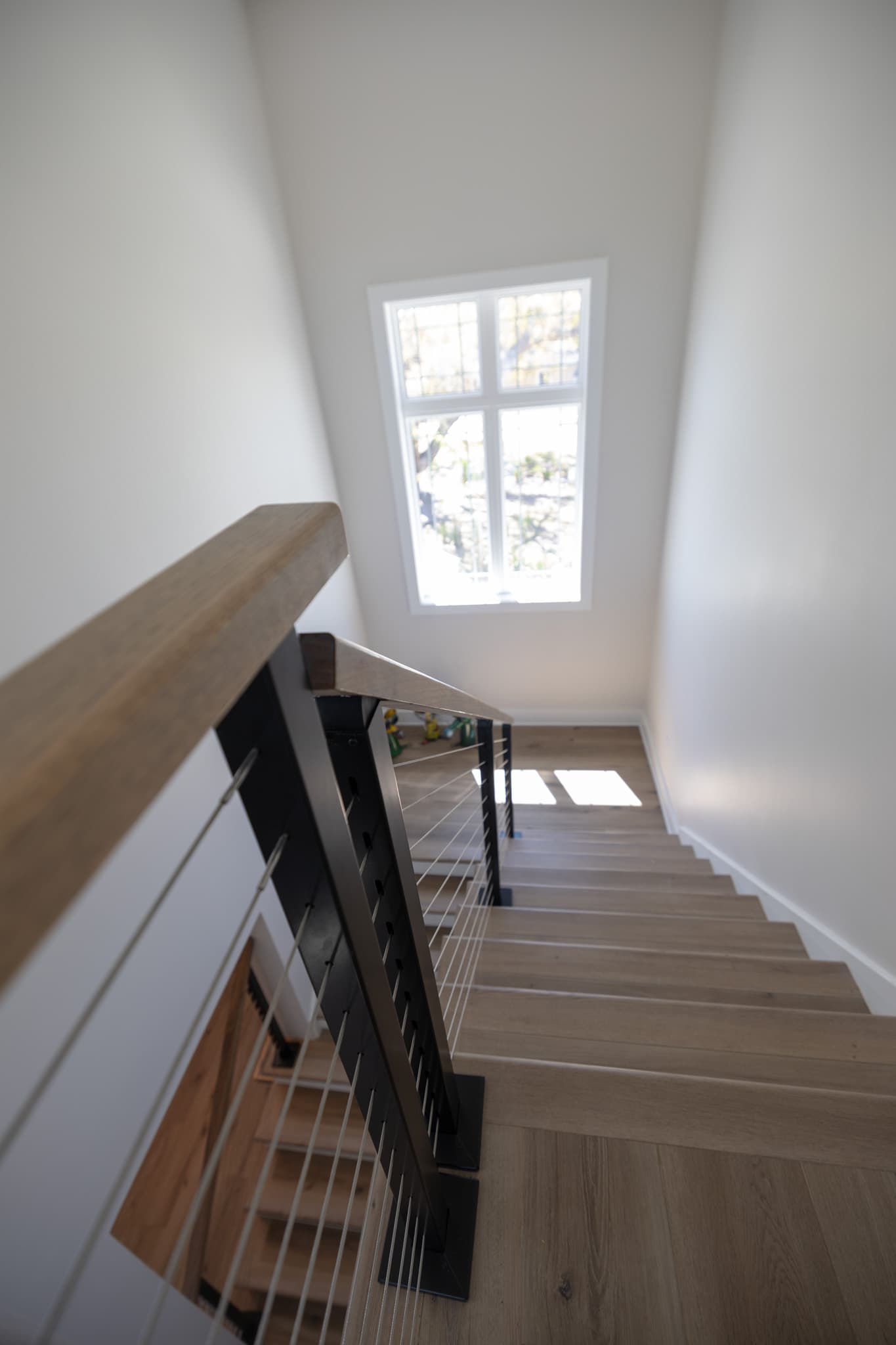 Finished interior staircase in an elevated coastal home
