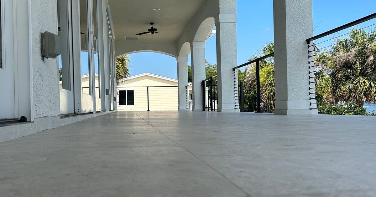 Covered porch with arched columns on a completed waterfront Florida room addition in St. Petersburg
