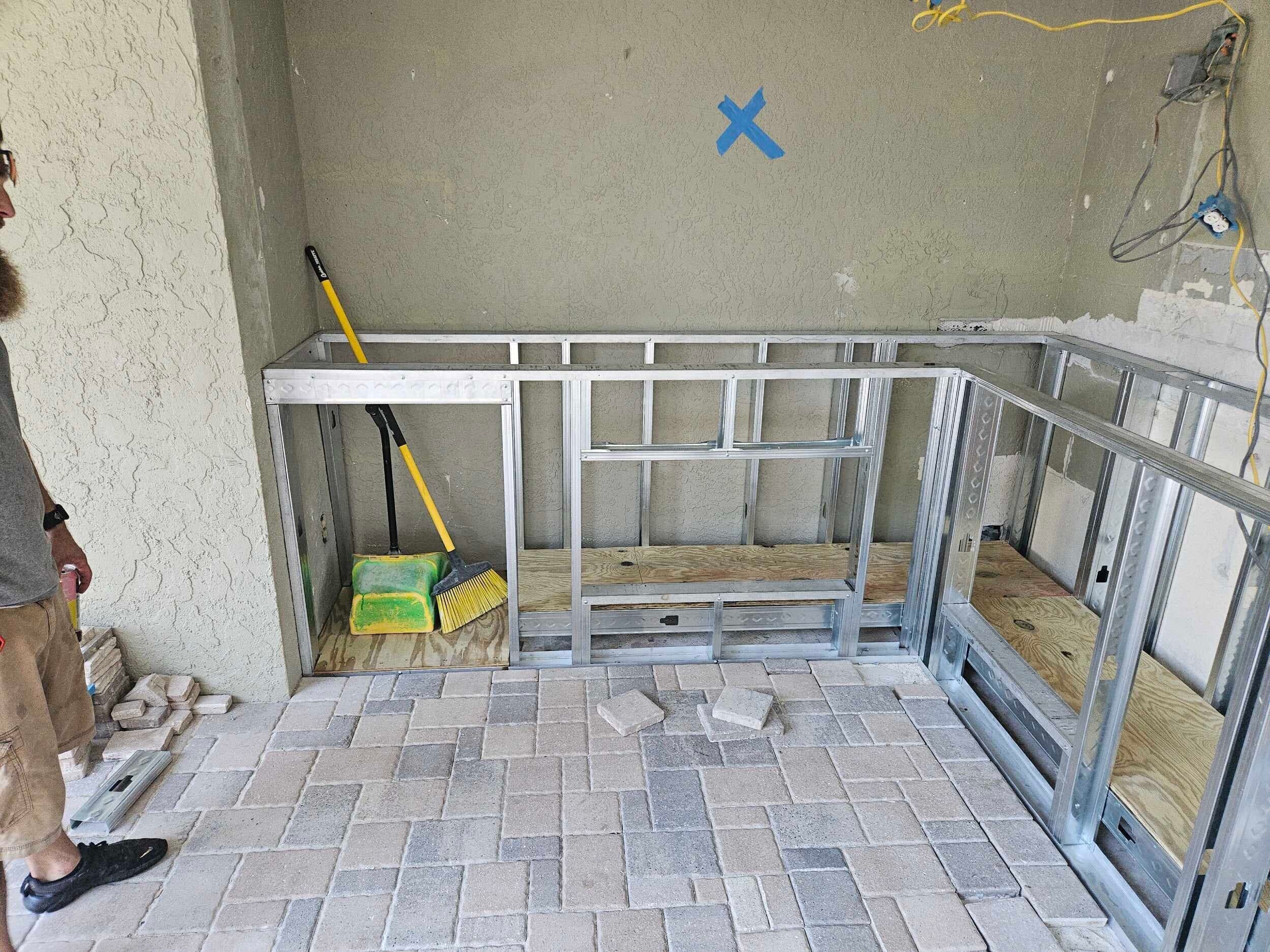 Outdoor kitchen addition framing and construction in progress