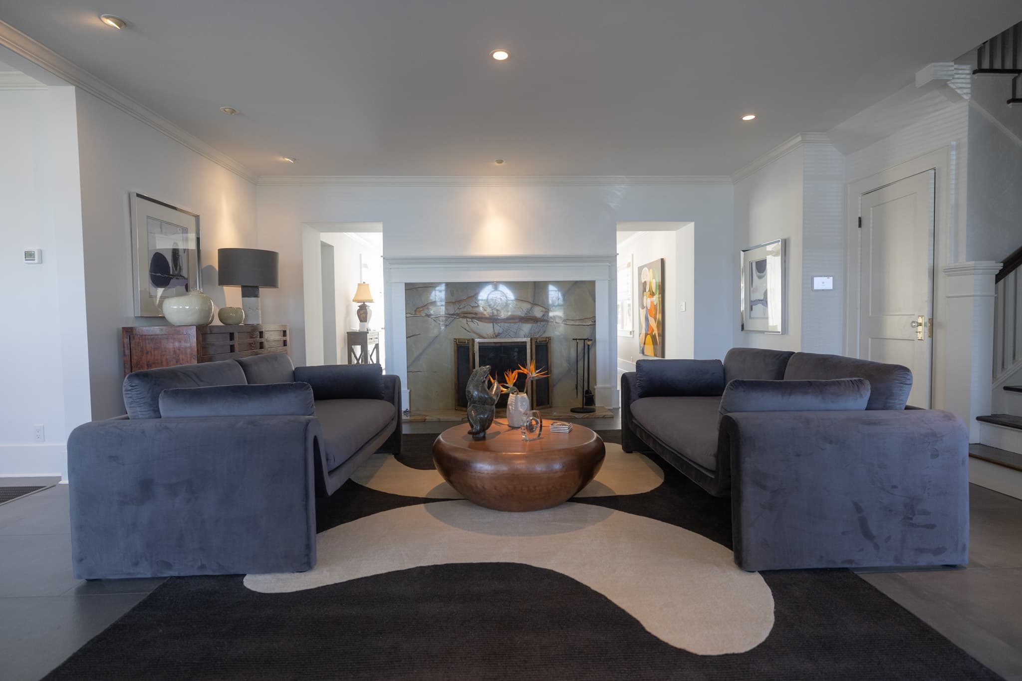 Luxury living room with designer fireplace and custom finishes in a Coffeepot Bayou home