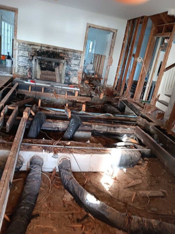 Living room before whole home remodel — dated finishes and closed floor plan in a 1950s St. Pete home