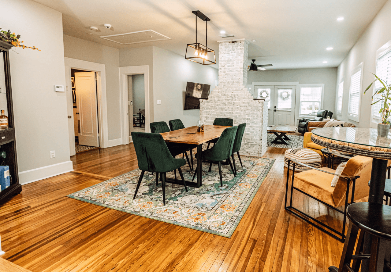Finished open-plan with brick fireplace re-cast as central feature between dining/living and kitchen — 175 19th Ave SE Old Southeast historic bungalow restoration