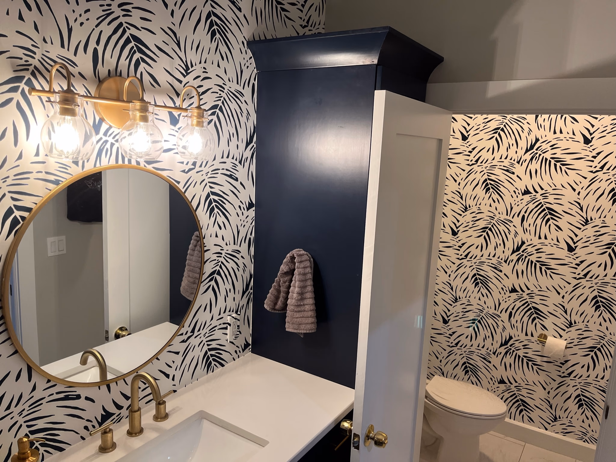 Period-appropriate half bath finish detail with rustic millwork flare — 175 19th Ave SE Old Southeast historic bungalow restoration