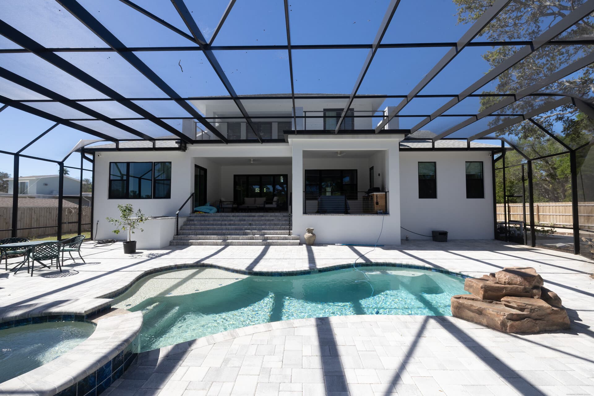 Modern two-story home with pool and screened lanai