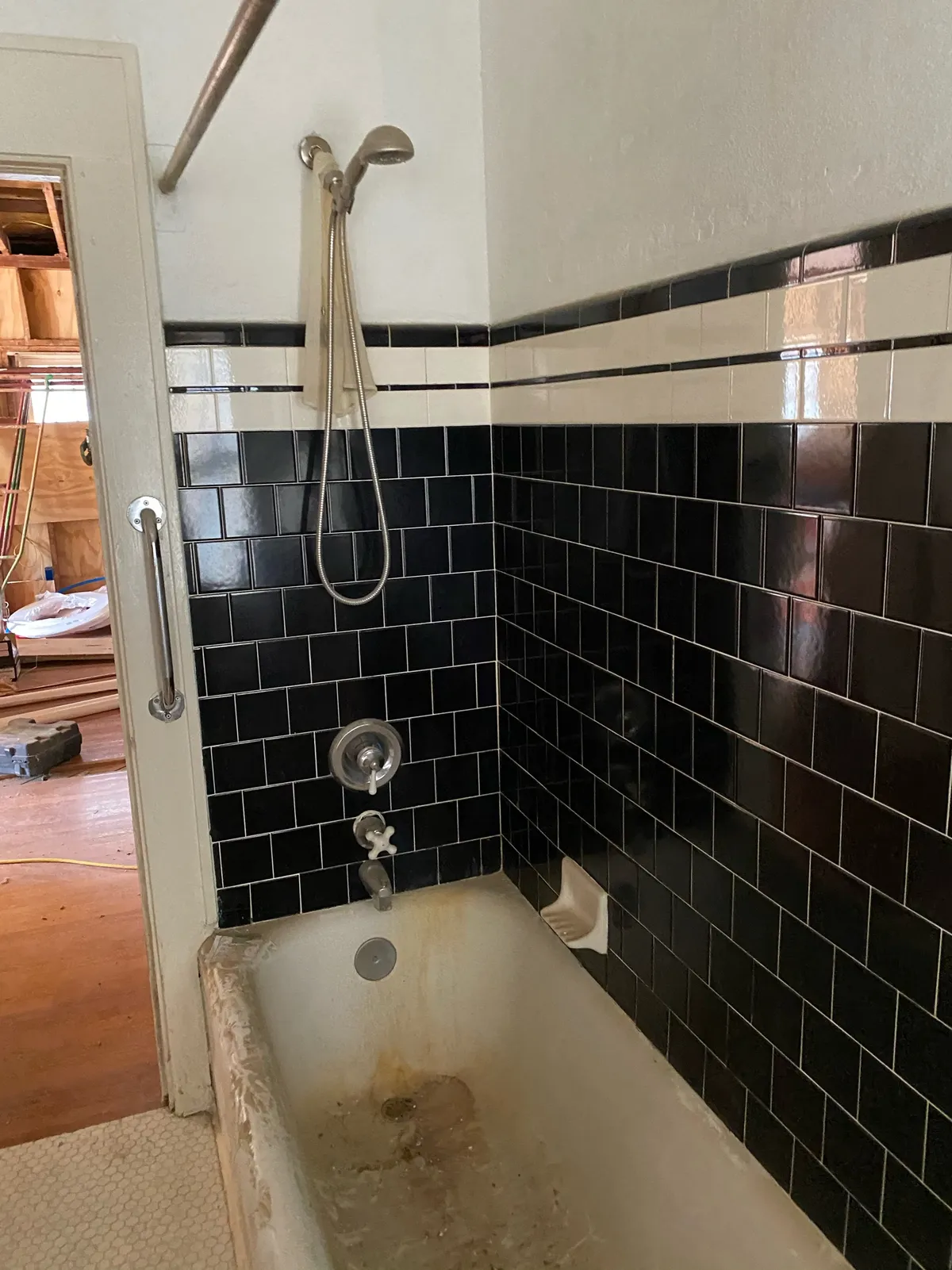 Dated bathroom with delaminating cabinetry and peeling paint