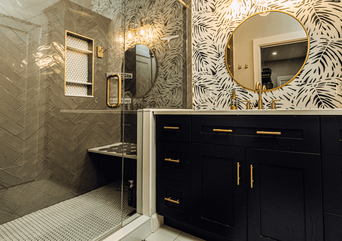 Finished primary bathroom in a St. Petersburg home with quartz double vanity and walk-in shower