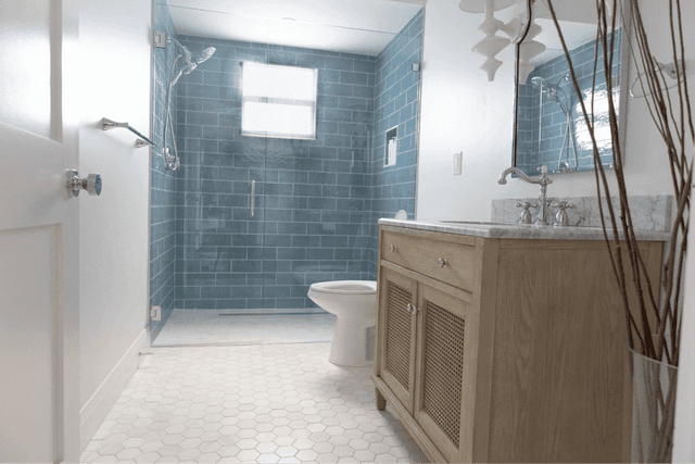 Completed luxury bathroom remodel with modern tile and fixtures