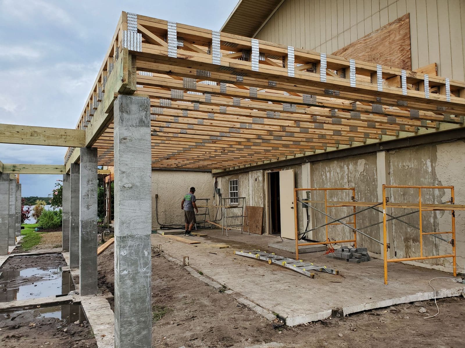 Structural framing and roof trusses going up on a home addition