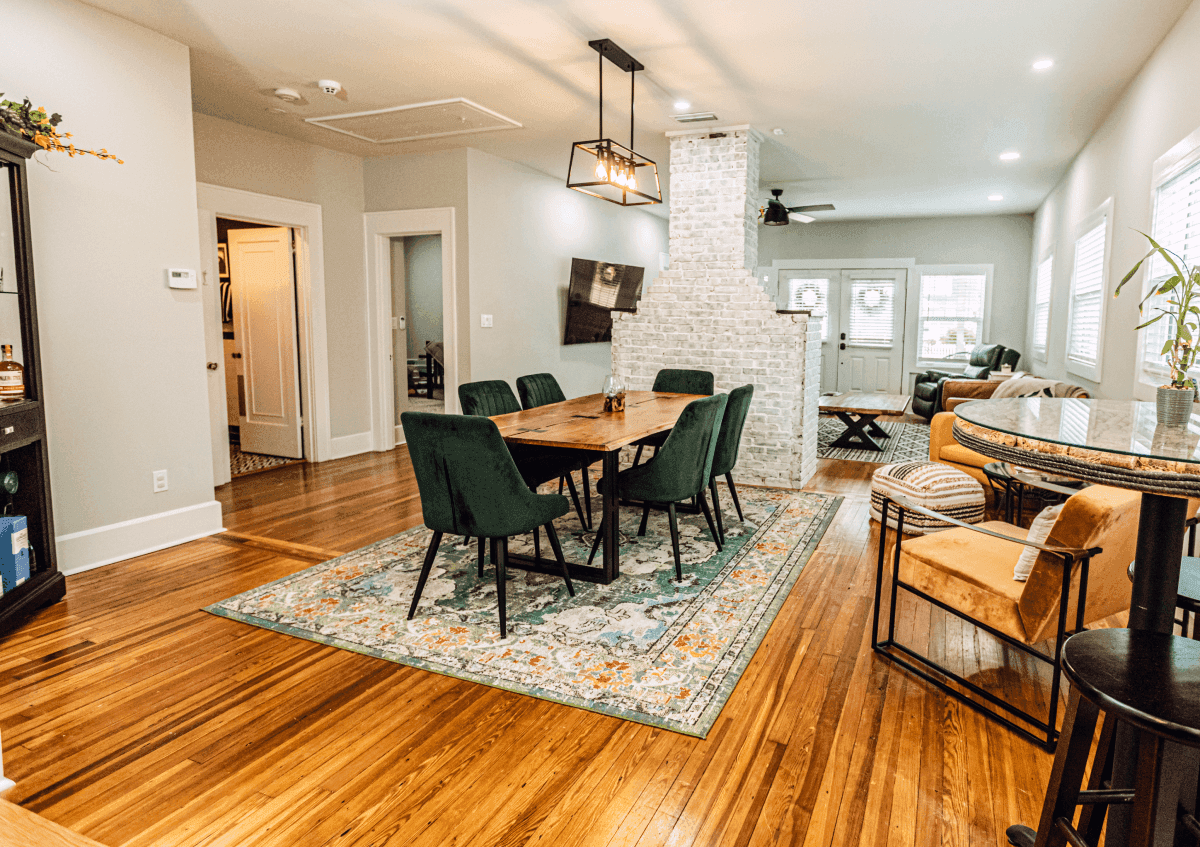 Open-concept dining and living room renovation by Revolution Contractors