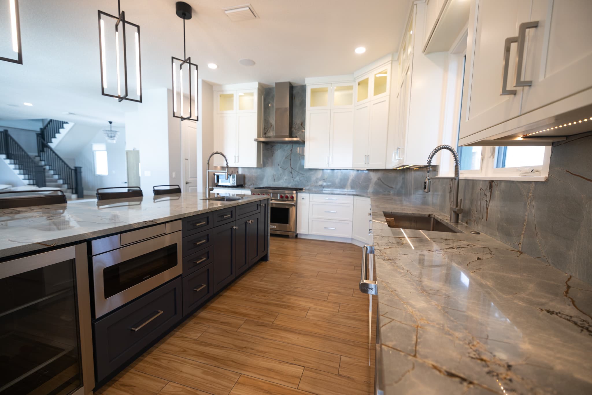High-end custom kitchen remodel with marble countertops by Revolution Contractors
