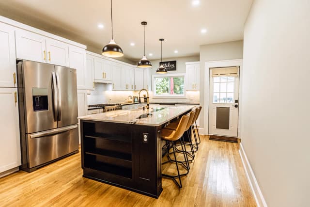 Completed kitchen remodel with island and modern finishes in St. Petersburg