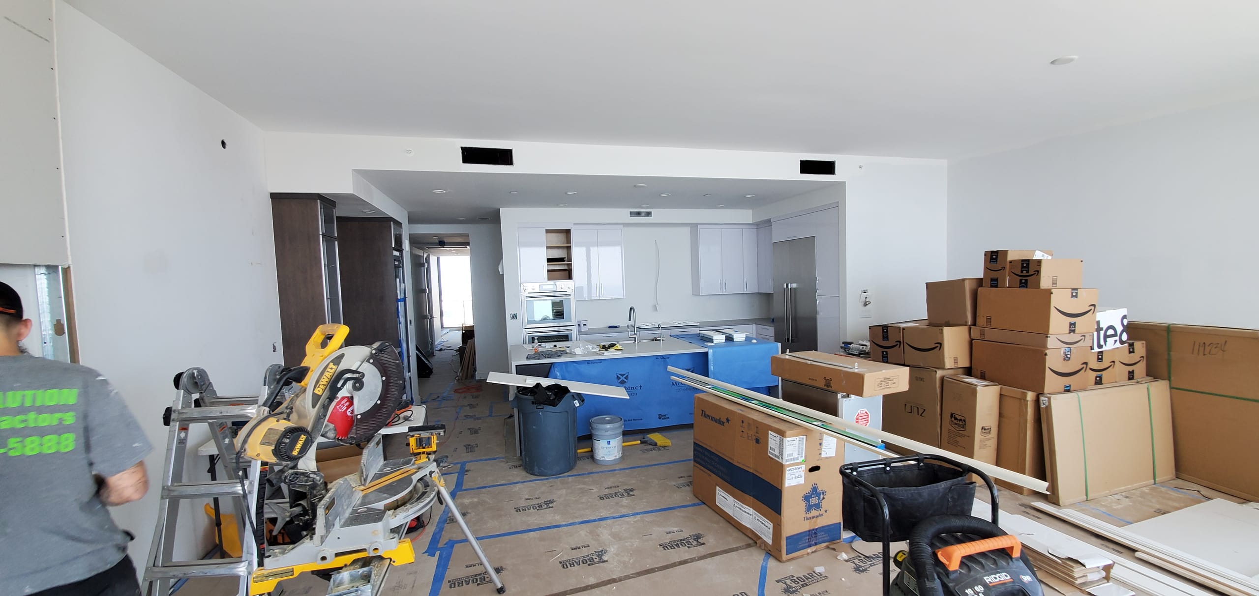 Material staging and delivery boxes inside high-rise condo unit during remodel