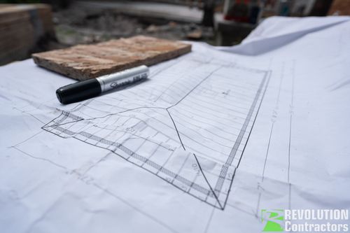 Construction blueprints on a St. Petersburg custom home job site